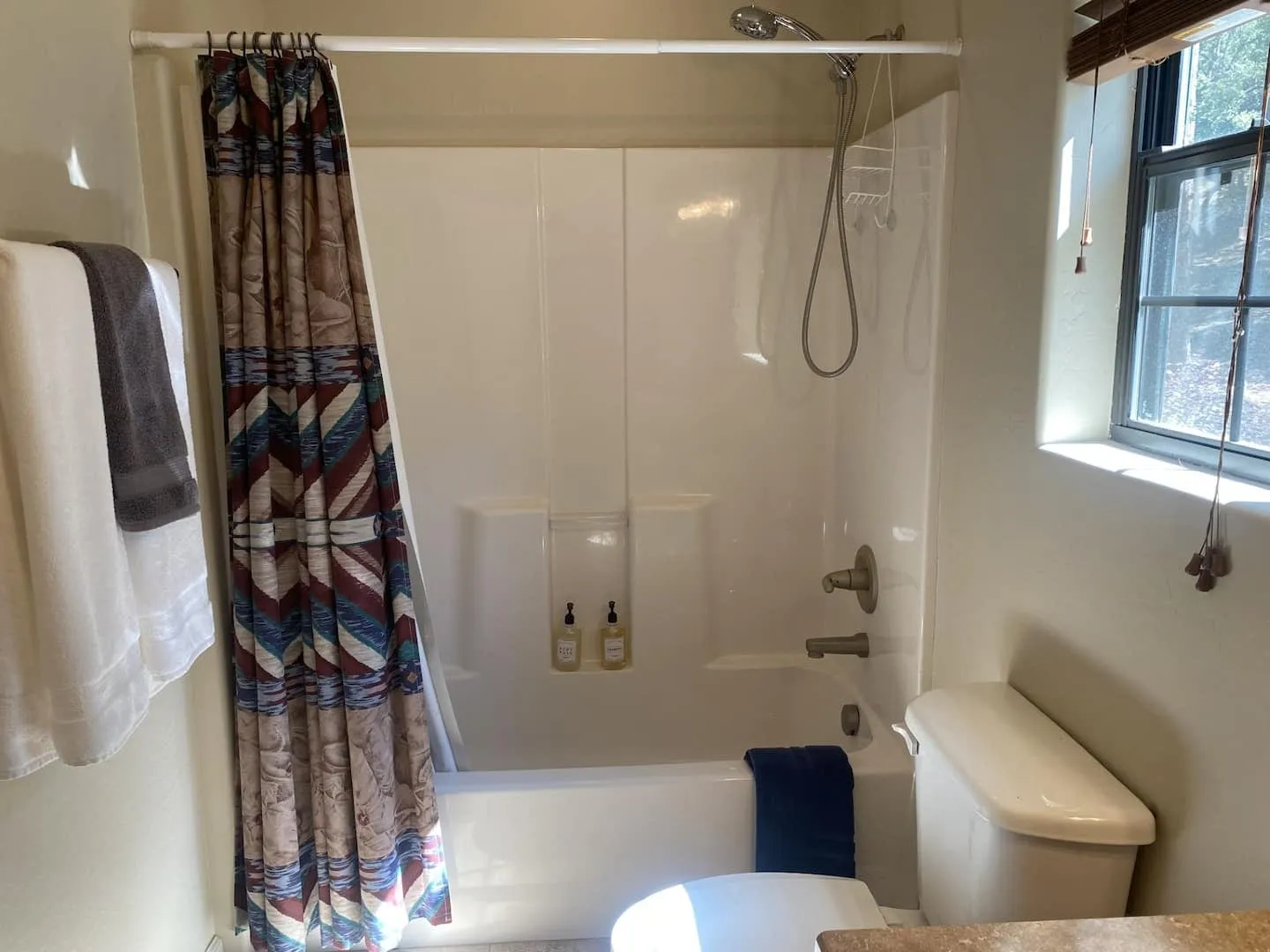 Full bathroom with a walk-in tiled shower