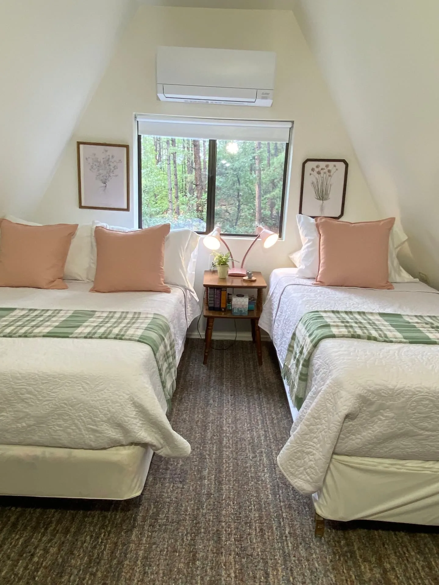 Bedroom with a desk and a pair of beds