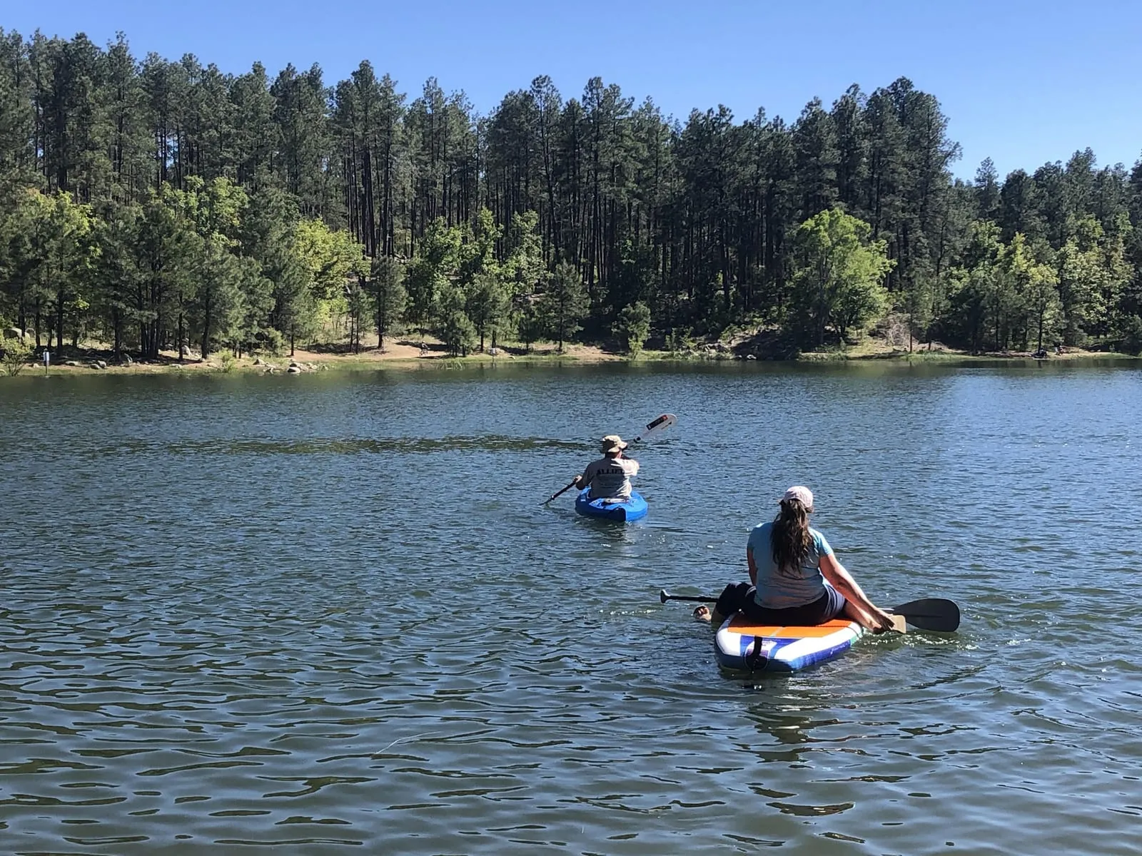 Paddling a calm, pine-ringed lake near Prescott